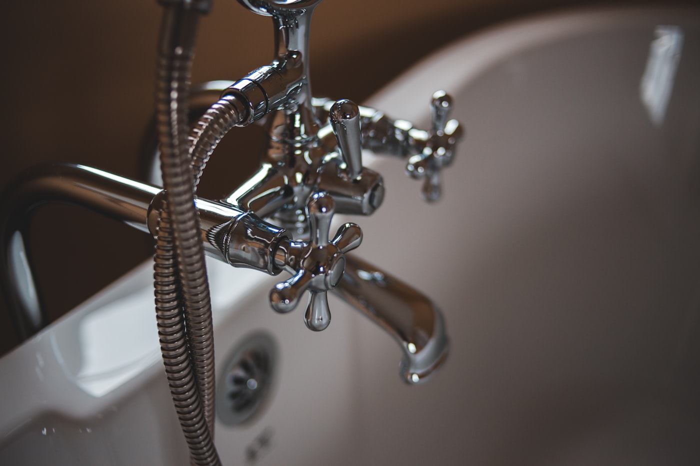 Westmoreland plumber repairing pipes under a kitchen sink